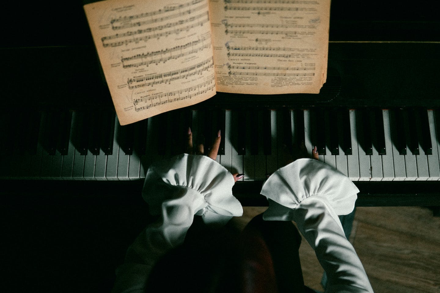 Christmas sheet music on a piano stand